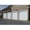 Large southern California garage with four single-stall, white garage doors