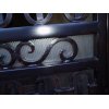 Close up of the scroll work on a custom steel gate in Bostonia, California.