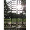 Driveway gate ideas. Decorative wrought iron swing gate with a grid design in San Diego